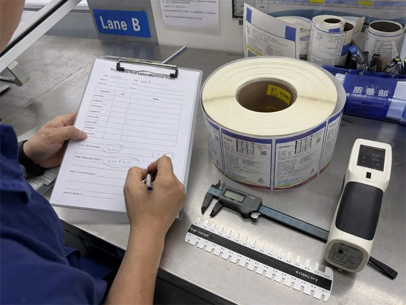 Application engineer performing pre-press audit on roll label specifications