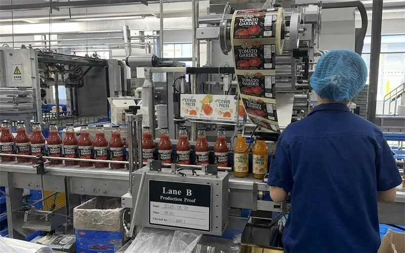 Roll-fed labels on high-speed food and beverage bottling line