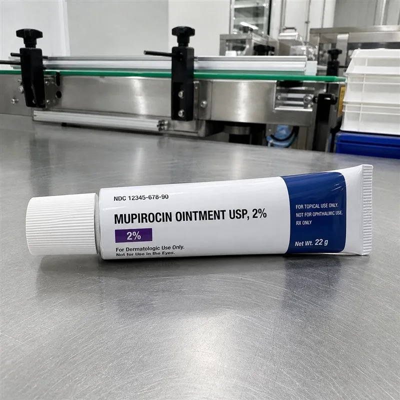 Pharmaceutical ointment tube with a crisp white laminate label and dosage panel