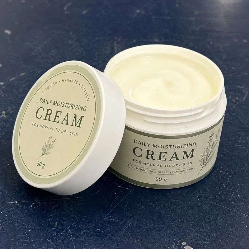 Custom label set on a cream jar lid and body