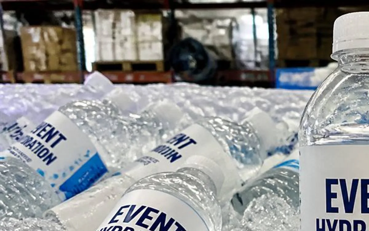 Event giveaway 16.9 oz bottle with bold full-wrap label readable from distance