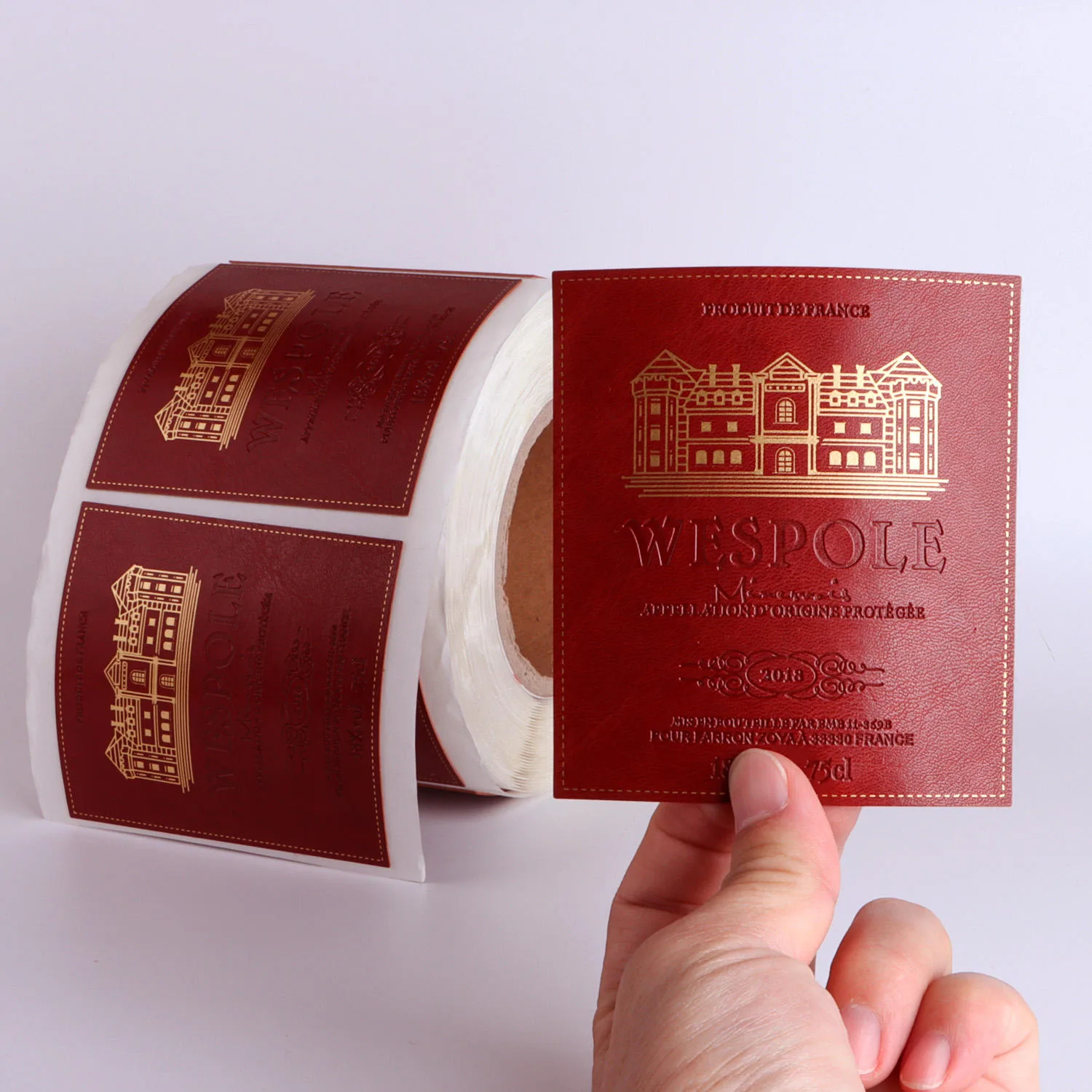 Red Wine Paper Label Held By Hand