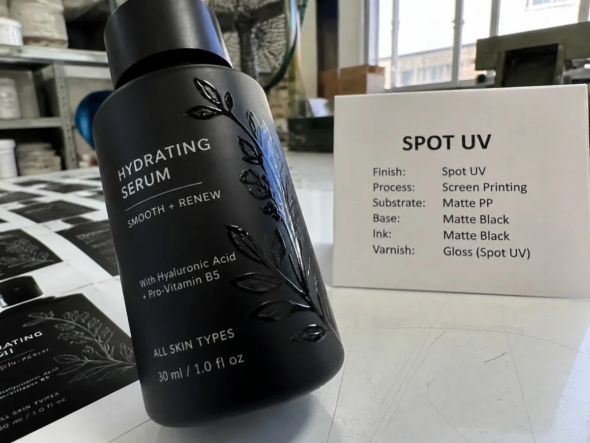 Spot UV highlights over a matte label field