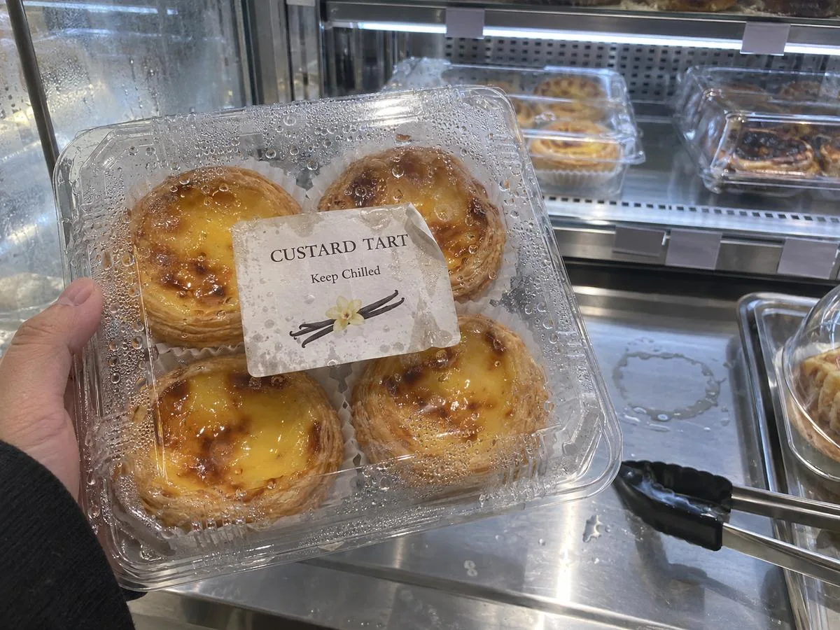 Condensation beads on a refrigerated pastry clamshell