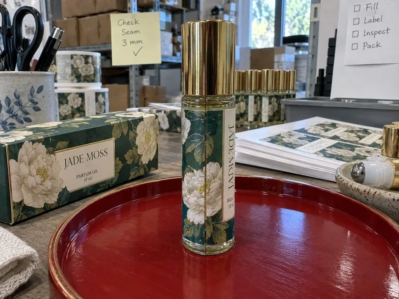 Wrap-around label covering a roll-on bottle