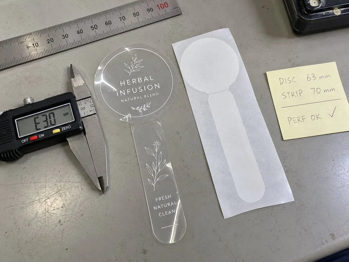 Connected lid seal circle and tamper strip anatomy with perforation line