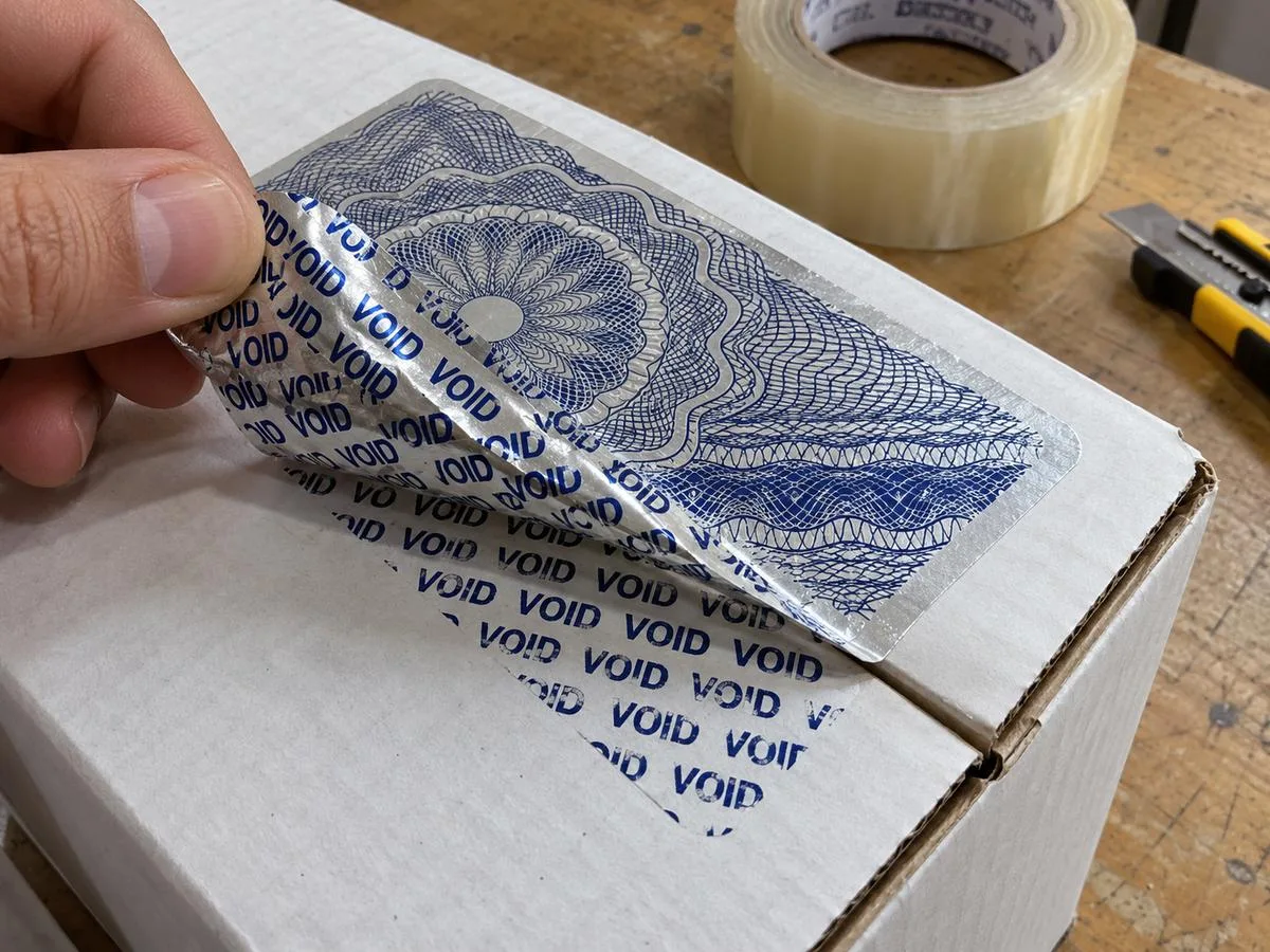 VOID message revealed on both the removed label and the carton surface
